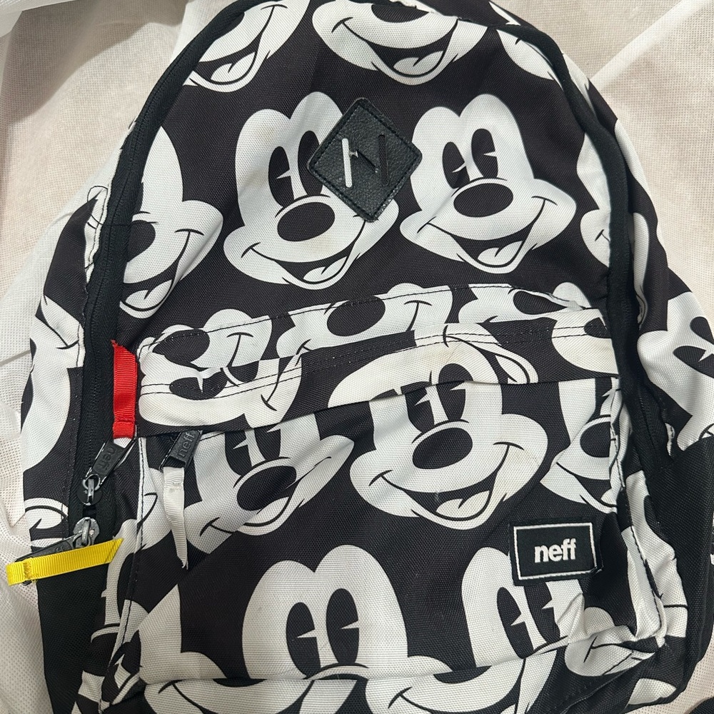 Neff Monochrome Character Backpack with Red and Yellow Accents